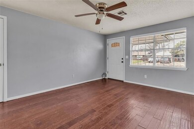 Unfurnished room featuring ceiling fan, a textured