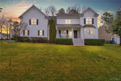 View of front property featuring a yard and covere