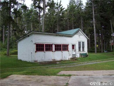 Parking Lot/Garage. The caretakers cottage is read