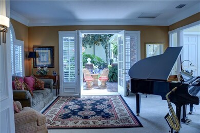 View of courtyard from living room through one of eight sets of French Doors on the 1st Floor
