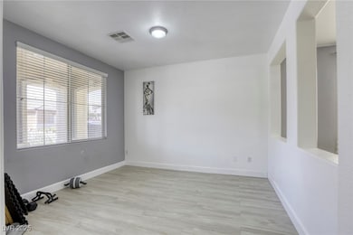 Spare room featuring light wood-style flooring