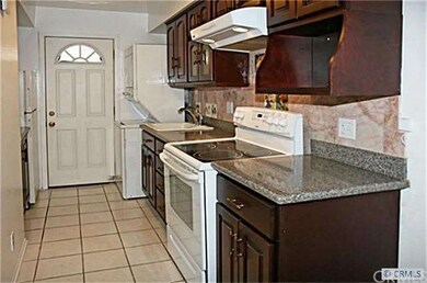 Kitchen has Granite-Style Countertops, Tile Backsp