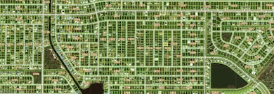 Aerial view of property's location featuring prope