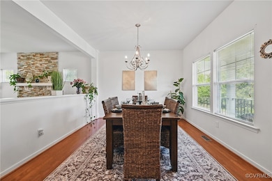 Dining area featuring a chandelier, wood finished