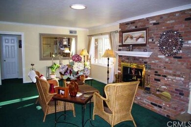 Living Room with a classic brick fireplace.