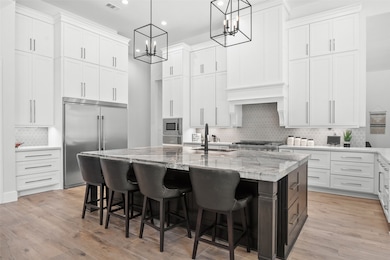 Gorgeous open kitchen with tons of custom cabinets