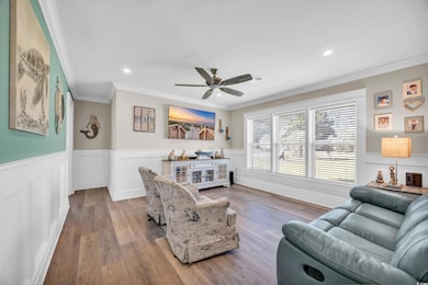 Living room featuring light wood-type flooring, ce