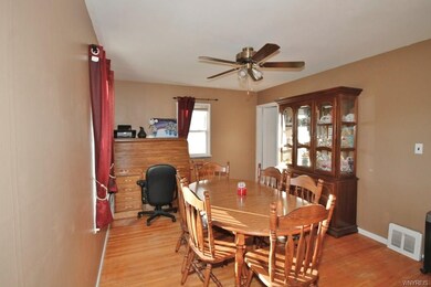 Adjoining dining room with hardwood floors.