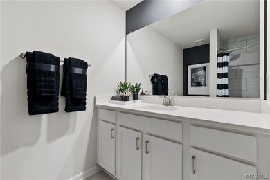 Bathroom with vanity and mirror