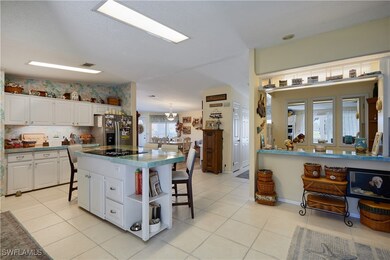 Kitchen with open shelves, white cabinetry, stainl