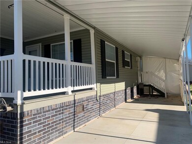 2 car carport with Vinyl roll up panels to keep le