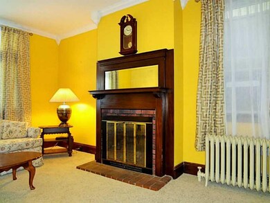 Living Room. A log burning fire place and brick an