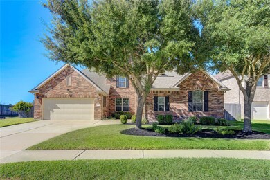 Brick facade and meticulous landscaping.
