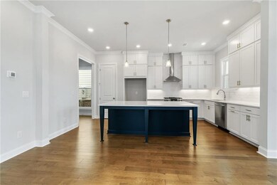 Kitchen includes Quartz countertops, 42 inch cabinets and SS appliances*Picture is not of actual home but same Camilla floorplan*