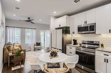 The light, bright kitchen offers granite counterto