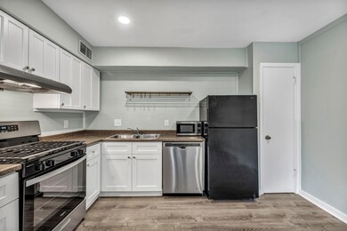 Kitchen with stainless steel appliances, a sink, 
