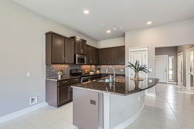 Kitchen featuring appliances with stainless steel