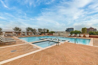 Sparkling rooftop pool with spa