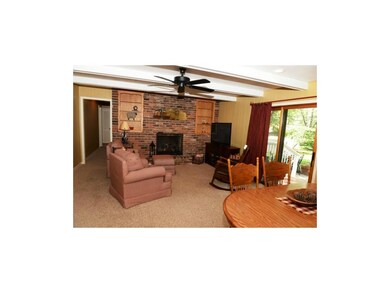 Family room with gas fireplace, built-in shelves, 