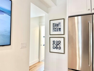 Kitchen with light wood-style floors, white cabin