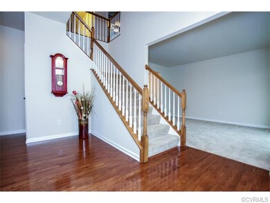 Beautiful 2 story foyer with hardwood floors.
