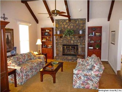 Bright Great Room Features Vaulted Beamed Ceiling,
