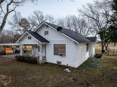 Bungalow-style home featuring a porch and a front 