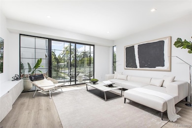 Living room featuring light wood-style floors and recessed lighting