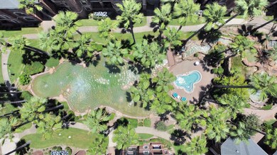 Lush landscaping with pond and Jacuzzi