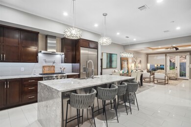 Large open kitchen with Thermador appliances, pot
