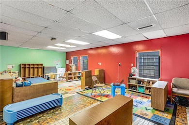 Rec room with a paneled ceiling