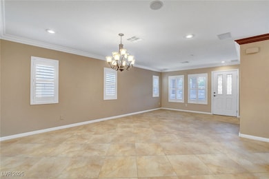 Spare room featuring visible vents, baseboards, an