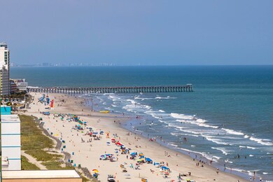 Property view of water with a beach view