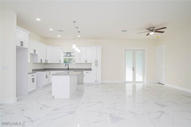 Kitchen featuring a center island, hanging light f