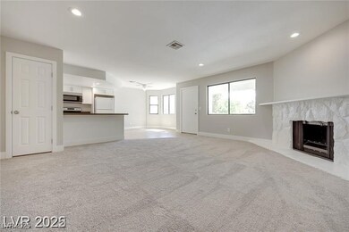 Unfurnished living room with a fireplace with rais