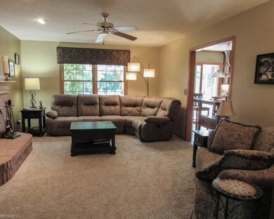 Family room with a brick fireplace.