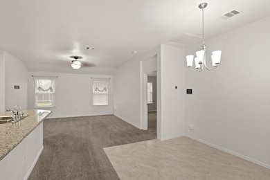 The open feel of the home, where the kitchen, dining and living room flow together seamlessly, is absolutely wonderful!