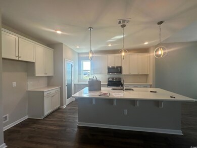 Kitchen with appliances with stainless steel finis
