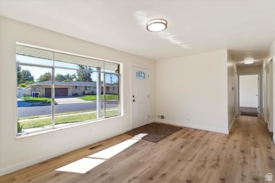 Foyer featuring light wood finished floors