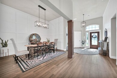 Formal Dining with cedar columns and board and batten accent wall. (Chandelier stays)