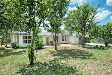 View of front of property featuring board and bat