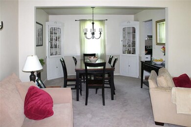 Dining room directly off of living room with built
