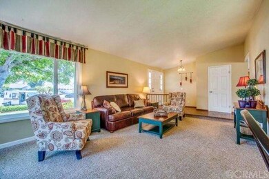 LIVING ROOM AND WINDOW TO FRONT YARD AND STREET 