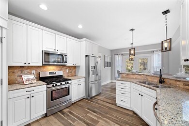 Stunning chef's kitchen includes a 5-burner stainl