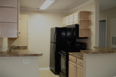 Kitchen featuring open shelves, baseboards, black 