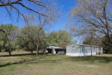 Featuring a 14'x80' mobile home....