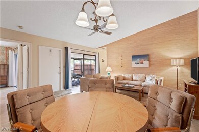 A view from the dining area to the living area and lanai.
