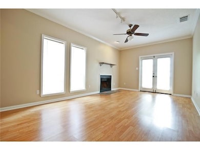 Unfurnished living room with rail lighting, a cei