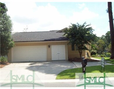 Exterior Front. 2 Garage and Golf Cart Storage.  G