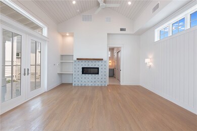 Double sided gas fireplace with custom tile accent